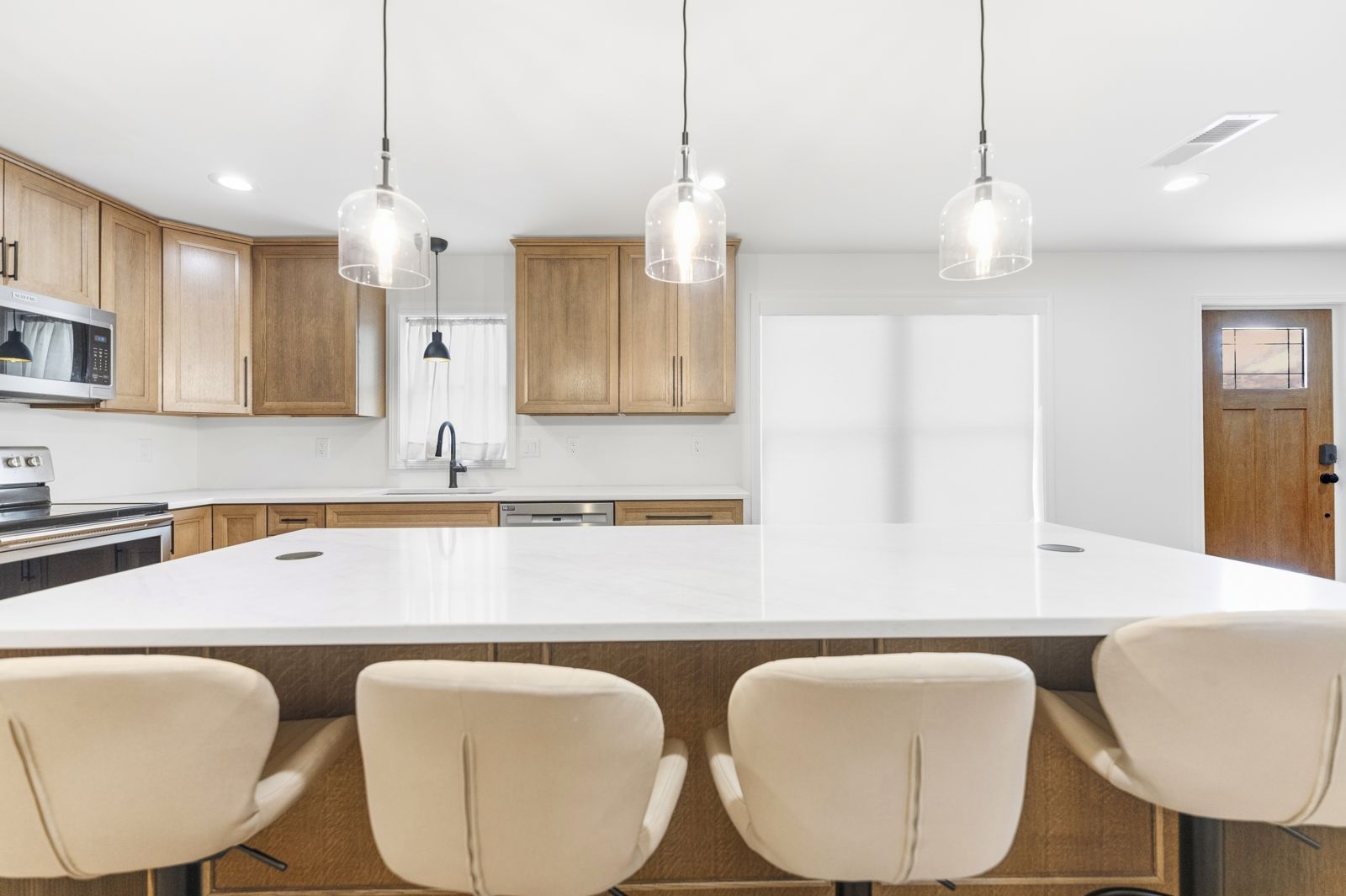 Island seating with cream upholstered stools